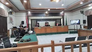 Sidang Perdana Dugaan Korupsi Penerbitan HPT Desa Senderak Bengkalis Digelar, Terdakwa Masih DPO